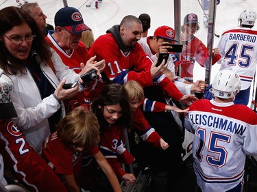 Mark Barberio and Tomas Fleischmann of the Montreal Canadiens are greeted by fans in Arizona as they take to the ice at Gila River Arena on Feb. 15, 2016, in Glendale.
