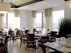 Windows in Le Havre de l’Estuaire’s dining room provide a view of the St. Lawrence River
