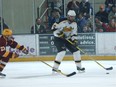 John Scott in action during his university days at Michigan Tech. Photo courtesy Michigan Tech Athletics.