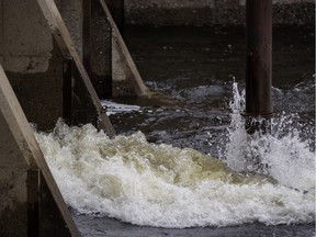 Water flows from Mégantic Lake into the Chaudière River in 2014.
