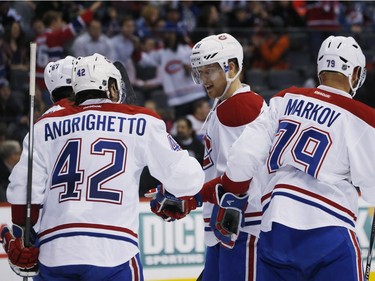 Montreal Canadiens centre Lars Eller, third from left, of Denmark, celebrates scoring a goal with, from left, left wing Max Pacioretty, right wing Sven Andrighetto, of Switzerland, and defenceman Andrei Markov, of Russia, against the Colorado Avalanche in the second period of an NHL hockey game Wednesday, Feb. 17, 2016, in Denver.