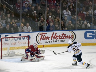 Buffalo Sabres' Marcus Foligno (82) scores on a penalty shot over the glove of Montreal Canadiens' Mike Condon (39) during the second period of an NHL hockey game, Friday, Feb. 12, 2016, in Buffalo, N.Y.
