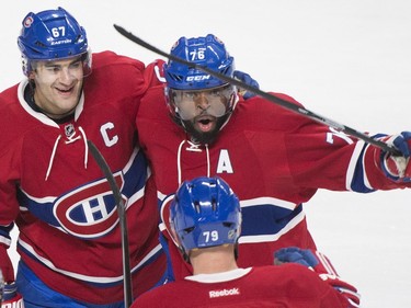 Montreal Canadiens captain Max Pacioretty (67) celebrates with teammates P.K. Subban (76) and Andrei Markov (79) after scoring against the Toronto Maple Leafs during third period NHL hockey action in Montreal, Saturday, February 27, 2016.