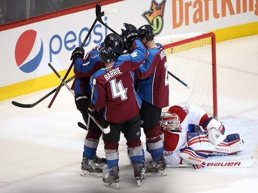 The Colorado Avalanche celebrate the game-winning goal by Jarome Iginla #12 of the Colorado Avalanche against goalie Ben Scrivens #40 of the Montreal Canadiens in the third at Pepsi Center on February 17, 2016 in Denver, Colorado. The Avalanche defeated the Canadiens 3-2.