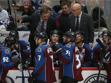 Head coach Patrick Roy (L) of the Colorado Avalanche directs his team along with assistant coach Dave Farrish (R) during a time out against the Montreal Canadiens at Pepsi Center on February 17, 2016 in Denver, Colorado. The Avalanche defeated the Canadiens 3-2.