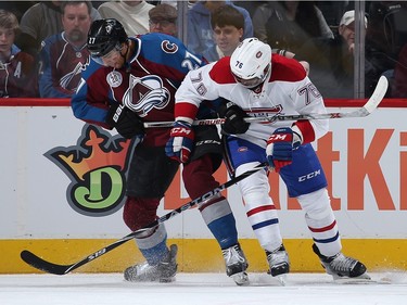 Andreas Martinsen #27 of the Colorado Avalanche and P.K. Subban #76 of the Montreal Canadiens battle for control of the puck at Pepsi Center on February 17, 2016 in Denver, Colorado.