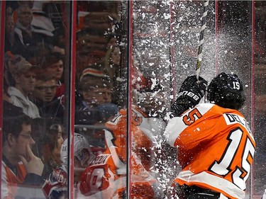 Michael Del Zotto #15 of the Philadelphia Flyers misses a check and crashes into the boards against the Montreal Canadiens during the third period at Wells Fargo Center on February 2, 2016 in Philadelphia, Pennsylvania.