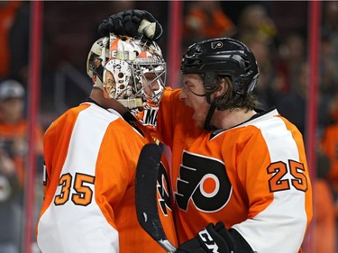 Goalie Steve Mason #35 and Ryan White #25 of the Philadelphia Flyers celebrate after defeating the Montreal Canadiens at Wells Fargo Center on February 2, 2016 in Philadelphia, Pennsylvania.