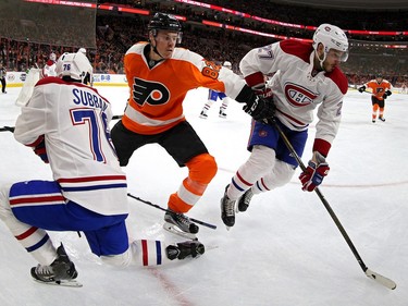 Alex Galchenyuk #27 of the Montreal Canadiens skates past Evgeny Medvedev #82 of the Philadelphia Flyers during the second period at Wells Fargo Center on February 2, 2016 in Philadelphia, Pennsylvania.