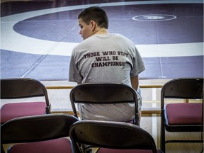 Joey Robertson waits for his match to begin during the GMAA wrestling championships at the Kahnawake Survival School on Thursday Feb. 11, 2016.