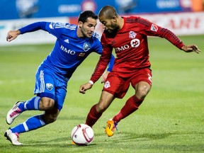 Impact's Ignacio Piatti, left, tries to go past Justin Morrow during the Montreal's playoff win over TFC at Saputo Stadium Oct. 29, 2015.