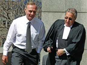 Former Montreal Canadiens player Guy Lafleur (left) returns to court with his lawyer at Palais de Justice in 2009.