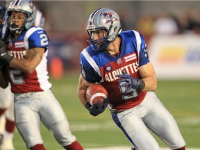 Alouettes' Eric Deslauriers turns upfield after catching the football during Canadian Football League game against the Edmonton Eskimos in Montreal Friday August 08, 2014.