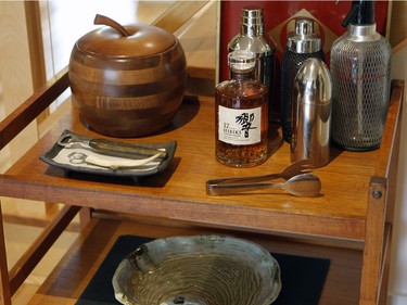 Japanese liquors and dishes gives an Oriental touch to Renaud Shareck's two-storey condo.  (Marie-France Coallier / MONTREAL GAZETTE)