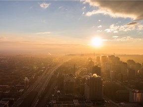MONTREAL, QUE.: DECEMBER 7, 2015 -- The sun sets in this view of the west side of Montreal seen from the 47th floor of the new Tour des Canadiens condo tower in downtown Montreal on Monday, December 7, 2015. (Dario Ayala / Montreal Gazette)