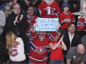A Montreal Canadiens fan celebrates Dale Wiese's goal against the Buffalo Sabres during second period of National Hockey League game in Montreal Wednesday February 3, 2016.