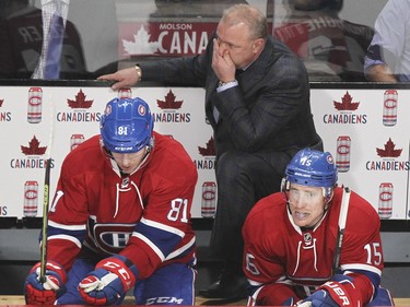 Montreal Canadiens coach Michel Therrien watches the action behind players Lars Eller, left and Tomas Fleischmann during third period of National Hockey League game against the Buffalo Sabres in Montreal Wednesday February 3, 2016.