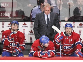 Canadiens coach Michel Therrien looks down while standing behind players Torrey Mitchell, Sven Andrighetto, Brendan Gallagher, Tomas Plekanec, Alex Glachenyuk and Nathan Beaulieu after Buffalo Sabres' Johan Larsson scored the winner during the third period in Montreal on Wednesday, Feb. 3, 2016.