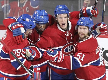 Montreal Canadiens, from left, Andrei Markov, P.K. Subban, Dale Weise and David Desharnais celebrate Weise's goal against the Buffalo Sabres during second period of National Hockey League game in Montreal Wednesday February 3, 2016.