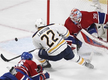 Montreal Canadiens goalie Mike Condon makes save on Buffalo Sabres Johan Larsson as defenceman P.K. Subban dives to help out during National Hockey League game in Montreal Wednesday February 3, 2016.