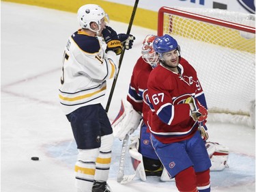 Montreal Canadiens Max Pacioretty, #67, and goalie Mike Condon react as Buffalo Sabres Jack Eichel goes to celebrate goal by teammate Mike Foligno during National Hockey League game in Montreal Wednesday February 3, 2016.