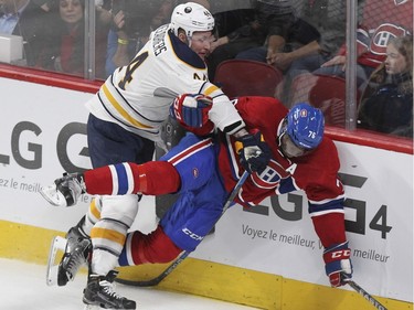 Montreal Canadiens P.K. Subban is knocked down by Buffalo Sabres Nicolas Deslauriers during first period of National Hockey League game in Montreal Wednesday February 3, 2016.
