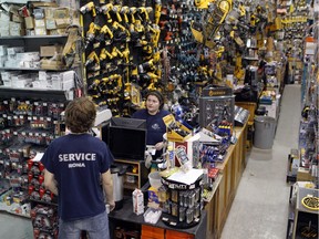 Patricia Venne, manager at the Rona store in St-Henri, speaks to a Rona employee on Wednesday February 3, 2016.