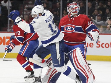 Montreal Canadiens goalie Ben Scrivens bumps with Tampa Bay Lightning Alex Kilorn during second period of National Hockey League game in Montreal Tuesday February 9, 2016.