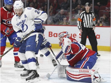 Montreal Canadiens goalie Ben Scrivens is screened by Tampa Bay Lightning Ryan Callahan as Lightning's Nikita Kucherov scores during second period of National Hockey League game in Montreal Tuesday February 9, 2016.