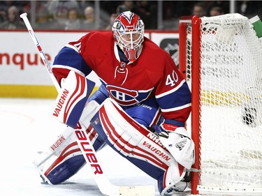 Montreal Canadiens goalie Ben Scrivens follows the puck as it is played in corner during second period of National Hockey League game against the Tampa Bay Lightning in Montreal Tuesday February 9, 2016.