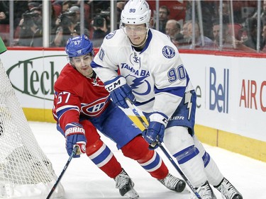 Montreal Canadiens Max Pacioretty pressures Tampa Bay Lightning Vladislav Namestkikov behind the Lightning net during third period of National Hockey League game in Montreal Tuesday February 9, 2016.