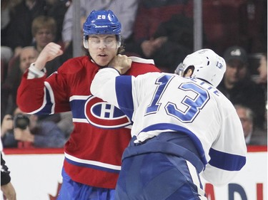 Montreal Canadiens Nathan Beaulieu, left, throws a punch at Cédric Paquette of the Tampa Bay Lightning during first period of National Hockey League game in Montreal Tuesday February 9, 2016.