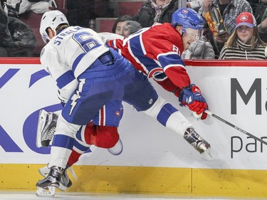 Tampa Bay Lightning Anton Stralman sticks a knee out to slow down Montreal Canadiens Lars Eller during third period of National Hockey League game in Montreal Tuesday February 9, 2016.