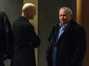 Bernard Trépanier, right, chats with Martin Daoust in the hallway prior to start of the corruption trial in the Contrecoeur real-estate development in room 5.05 at the Palais de Justice in Montreal, on Wednesday, February 10, 2016.