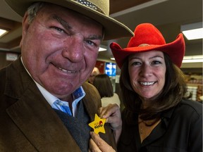 Michel Poirier, left, was named honorary chairman of festival Saint-Lazare au Galop 2016 on Monday, February 15, 2016. Pamela Tremblay, right, the ambassador for the festival, adjusts the "new sheriff's" star at the press conference. (Dave Sidaway / MONTREAL GAZETTE)