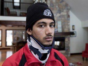 Sixteen year old James Orr wears a neck brace while at home in Montreal, on Tuesday February 16, 2016. Orr suffered a fractured vertebra after an illegal hit while playing for the Lac St. Louis Lions.