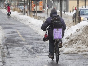 A Montreal cyclist takes the Rachel St. bike path near St-Hubert St. on Wednesday Feb. 17, 2016.