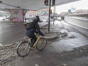 A Montreal cyclist takes the St Laurent Blvd. bike path under the Van Horne St. overpass, on Wednesday Feb. 17, 2016.