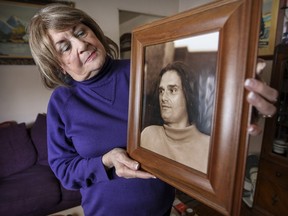 Gayle Barrett with a photo of her son Jamie Johnston in her LaSalle apartment.