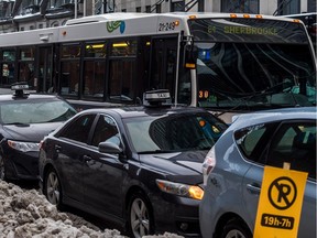 Taxi drivers protested against UberX in Montreal Feb. 17, 2016, by occupying parking spaces along both sides of Sherbrooke St. during the morning rush hour. Parking along major city thoroughfares during morning and afternoon rush hours is not permitted.