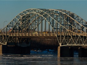 A dump truck caused an early morning closure of the Mercier Bridge in LaSalle Feb. 18, 2016, after the bucket, which had become unhooked, hit and bent a part of the bridge's superstructure.