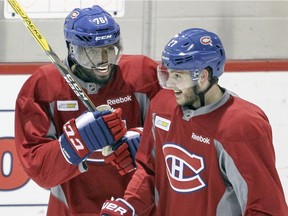 Canadiens P.K. Subban, left, jokes with Alex Galchenyuk during practice at the team's training facility in Brossard on Feb. 19, 2016.