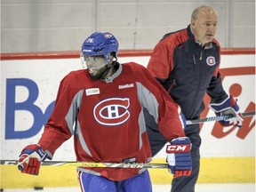 P.K. Subban and coach Michel Therrien skate past each other during practice at the team's training facility in Brossard on Feb. 19, 2016.