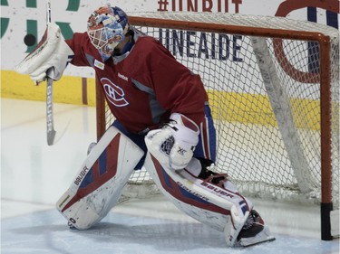 Montreal Canadiens goalie Mike Condon stops a series of quick shots on net during team practice at the Bell Sports Complex in Montreal on Monday February 22, 2016.