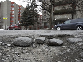 A pothole at the corner of Charlevoix and Lionel Groulx in Montreal photographed on Tuesday February 23, 2016.(Marie-France Coallier / MONTREAL GAZETTE)