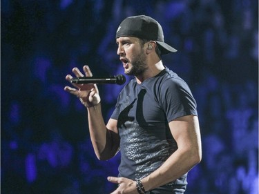 Luke Bryan drops the mic during concert at the Bell Centre in Montreal Thursday February 25, 2016.