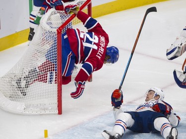 Devante Smith-Pelly of the Montreal Canadiens holds onto the Edmonton Oilers net after crashing into it  in the first period of an NHL game at the Bell Centre in Montreal on Saturday, Feb. 6, 2016.