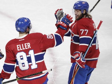 Lars Eller and Tom Gilbert of the Montreal Canadiens celebrate Eller's goal in the first period of an NHL game at the Bell Centre in Montreal on Saturday, Feb. 6, 2016.