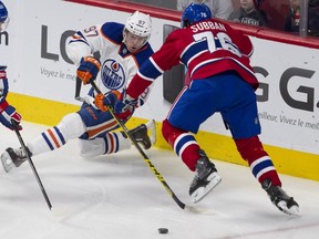 P.K. Subban of the Montreal Canadiens and Connor McDavid of the Edmonton Oilers battle for the puck in the first period of an NHL game at the Bell Centre in Montreal on Saturday, Feb. 6, 2016.