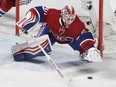 Habs goalie  Ben Scrivens  dives on a loose puck in the first period of Sunday's game against the Carolina Hurricanes.